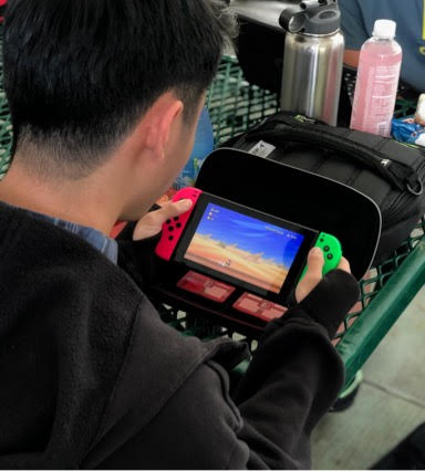 Michael Tam, an 11th grader plays on the Nintendo Switch. 
Photo by staff photographer Kayla Marutani. 