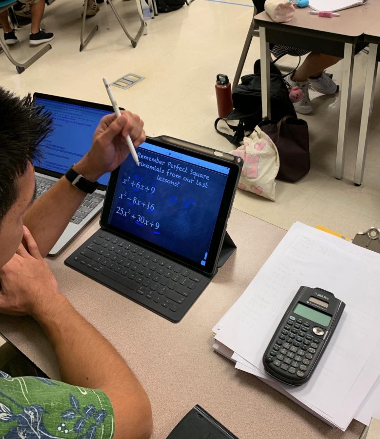 Math teacher Raymond LaFleur uses his iPad Pro to help students visualize their work for math problems. 