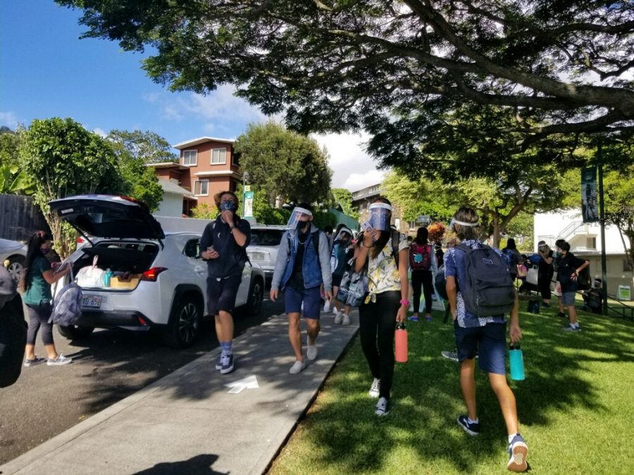 Students walking with their masks and face shields on their first day back to school in-person. Mid-Pacific opened campus up to ninth graders on Nov. 9 and staggered the rest of the grades' returns throughout the week. All grades attended on Nov. 13.