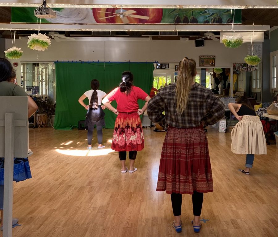 Hula students standing in ready position six feet apart from each other. Mid-Pacific’s hula program is not deeply affected by social distancing guidelines. 