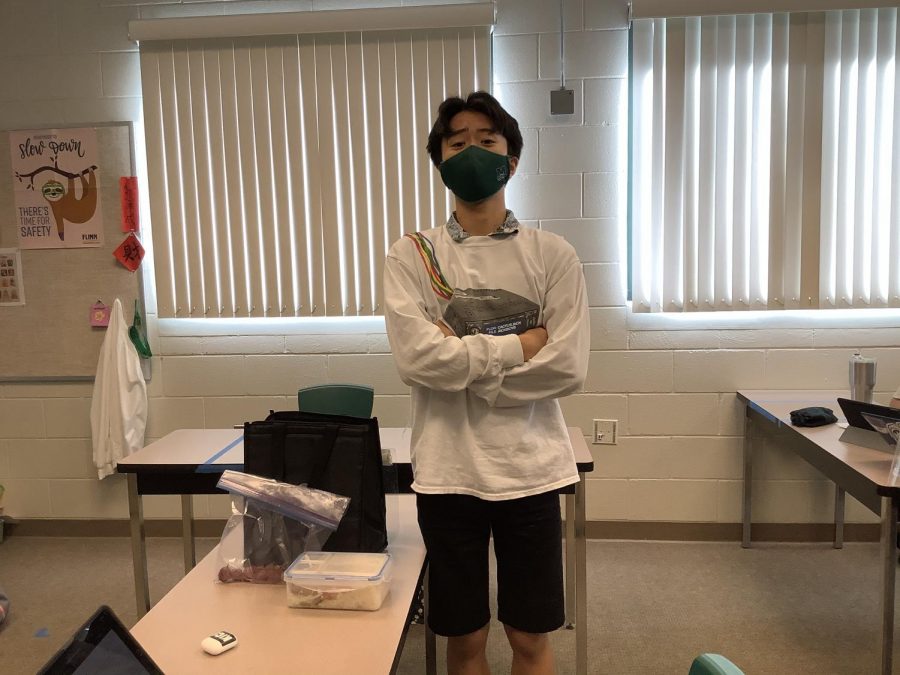 Sophomore Keiichiro Sato shows his packed lunch and snacks for the day. COVID-19 has impacted Mid-Pacific students to carry different items in their bags as part of their regular school days.