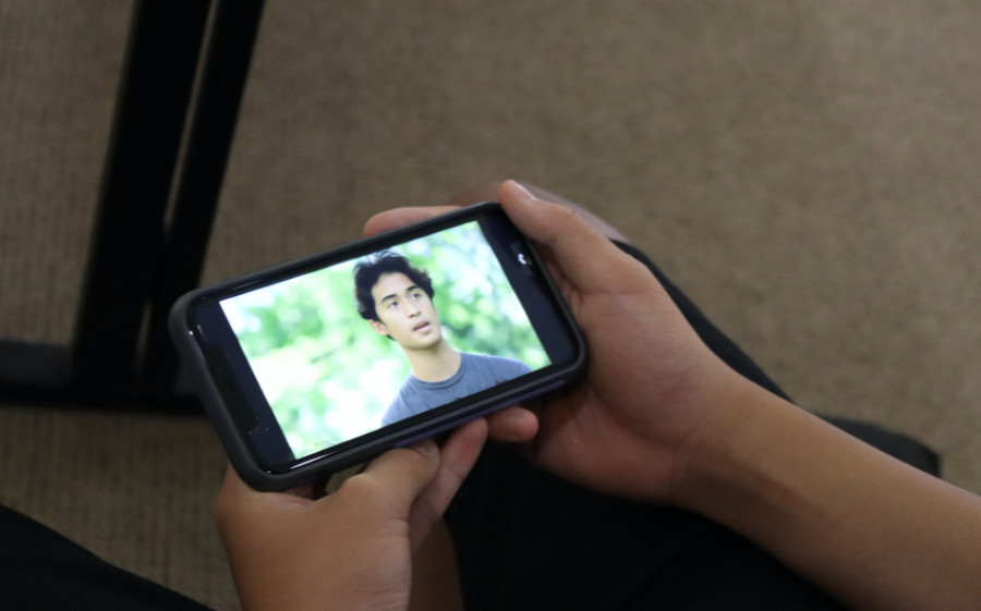 A Mid-Pacific student watches the IGTV series, Chat Sessions during school. 2019 alumni Kira Morimoto directed this series and interviews former students to talk about their favorite school.