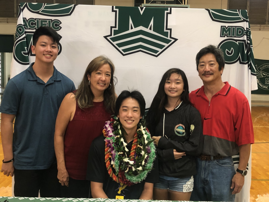 Lee Matsuzaki smiles with his family after signing a scholarship offer for baseball. Matsuzaki said he is excited to play with the coaches at Howard. “There is something really special over there," said Matsuzaki.