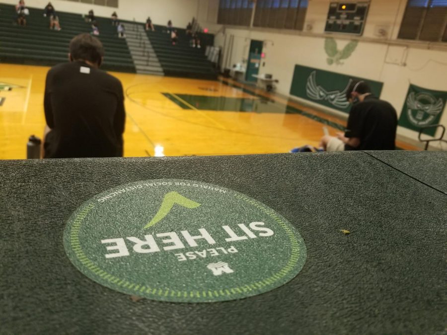  A socially distanced sticker lies in the gymnasium for students to sit and be safe. The Mid-Pacific community shared how they are coping in a CO- VID-19 school environment. 