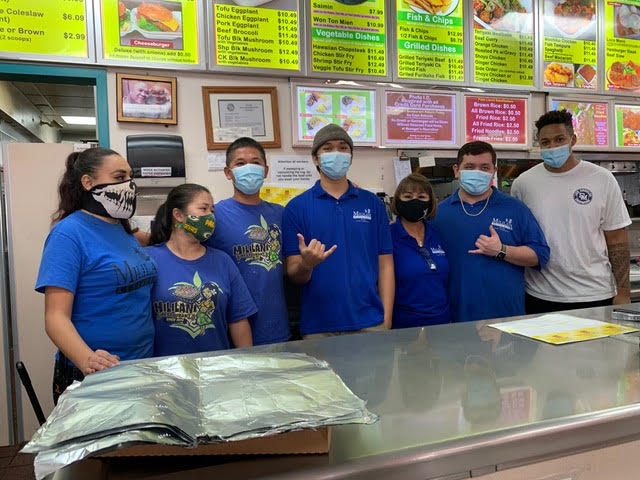 Ready for work, Mililani Restaurant staff gather for a group photo between orders. 