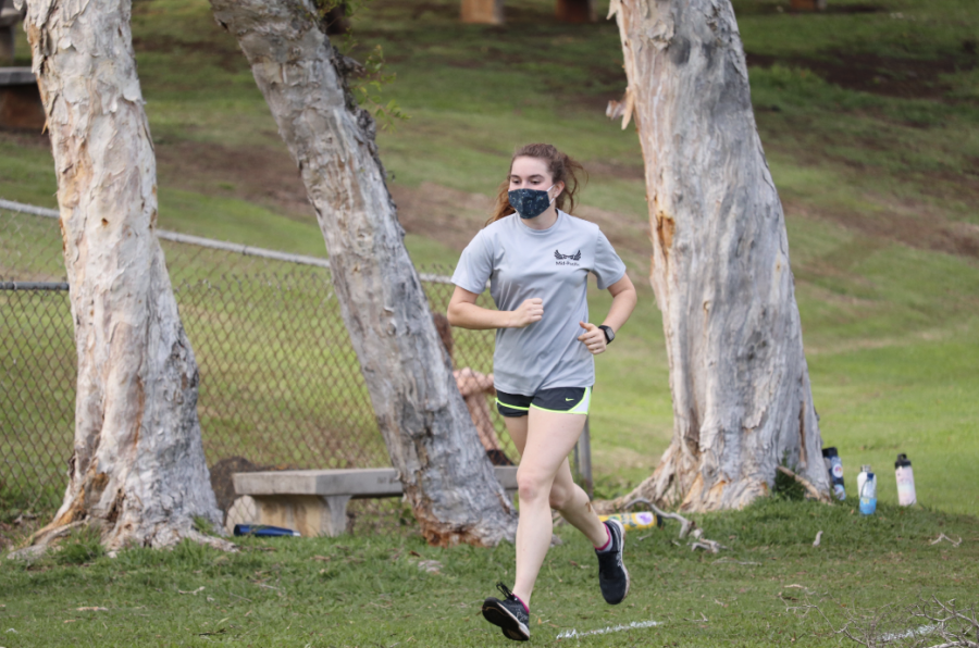 Sophomore Quinn Gilman runs during cross country practice. Virtual races are happening during the pandemic. 