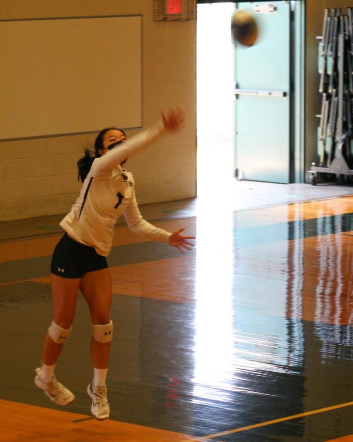 Senior #7, Alyssa Muraoka servers the ball during her senior game. Muraoka was one of six athletes committed playing on the starting team for girls volleyball. 