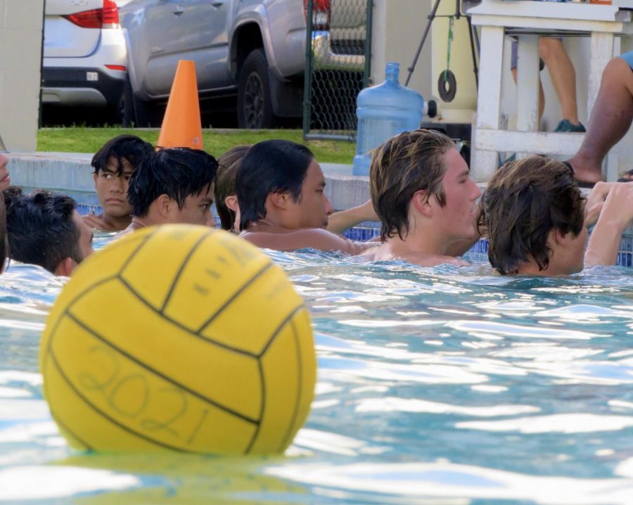 Players receive the post-scrimmage speech from their coach after the Mid-Pacific vs Mid-Pacific senior night scrimmage on April 29.