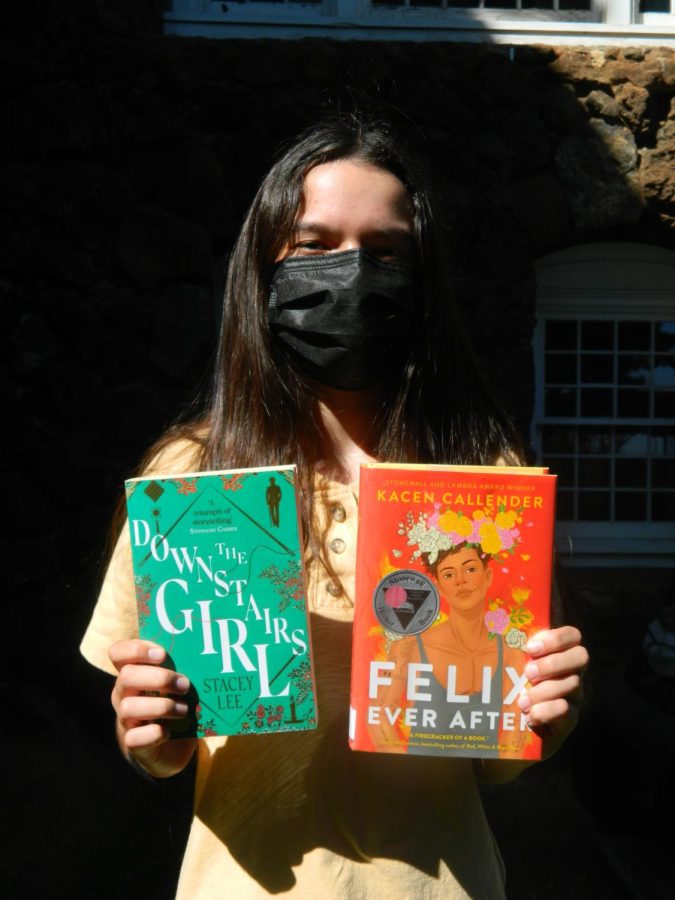 Freshman Eva Rogers holds her favorite books from Representative Matt Krauses booklist, The Downstairs Girl 
and Felix Ever After.