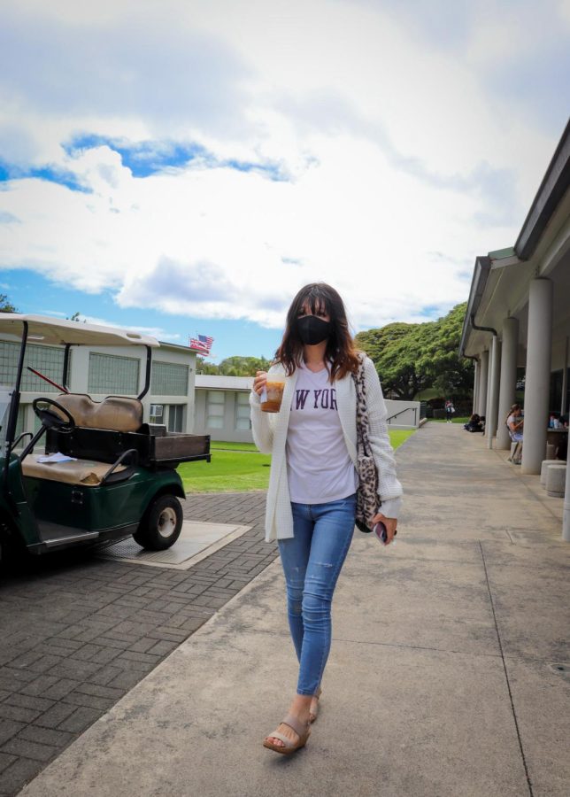 Laulea Haga walking to her next class wear a shirt, jacket, jeans, and heels. 