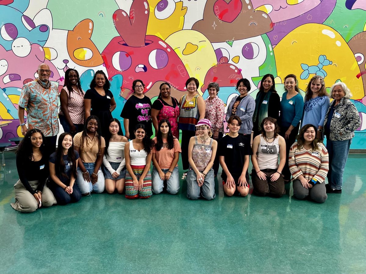 DEI Club and other clubs from other schools pose for a photo together in Scudder Cafeteria.