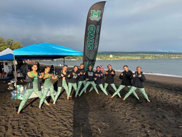 Paddling girls pose for a photo before their race