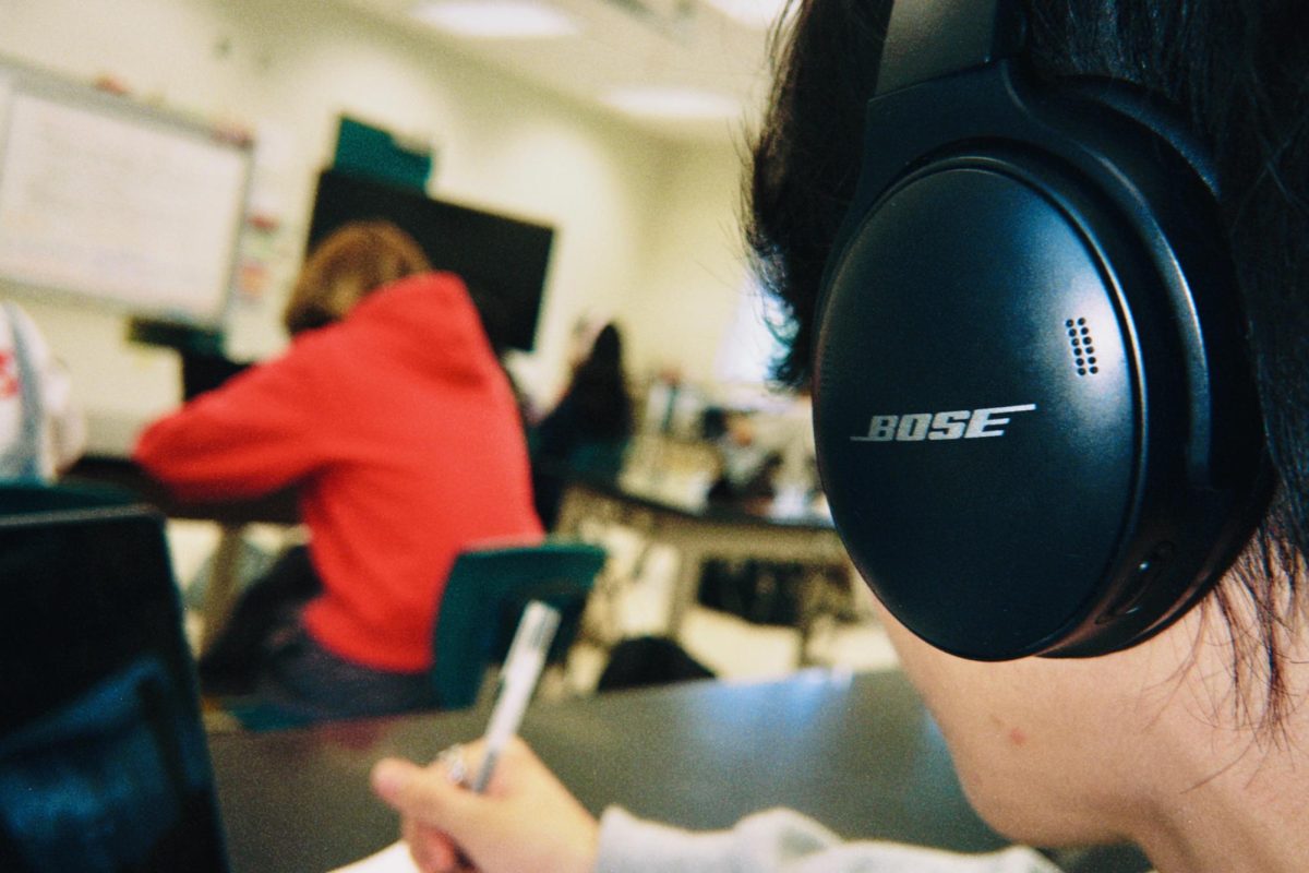 Mid-Pacific student listening to music while working on school work.