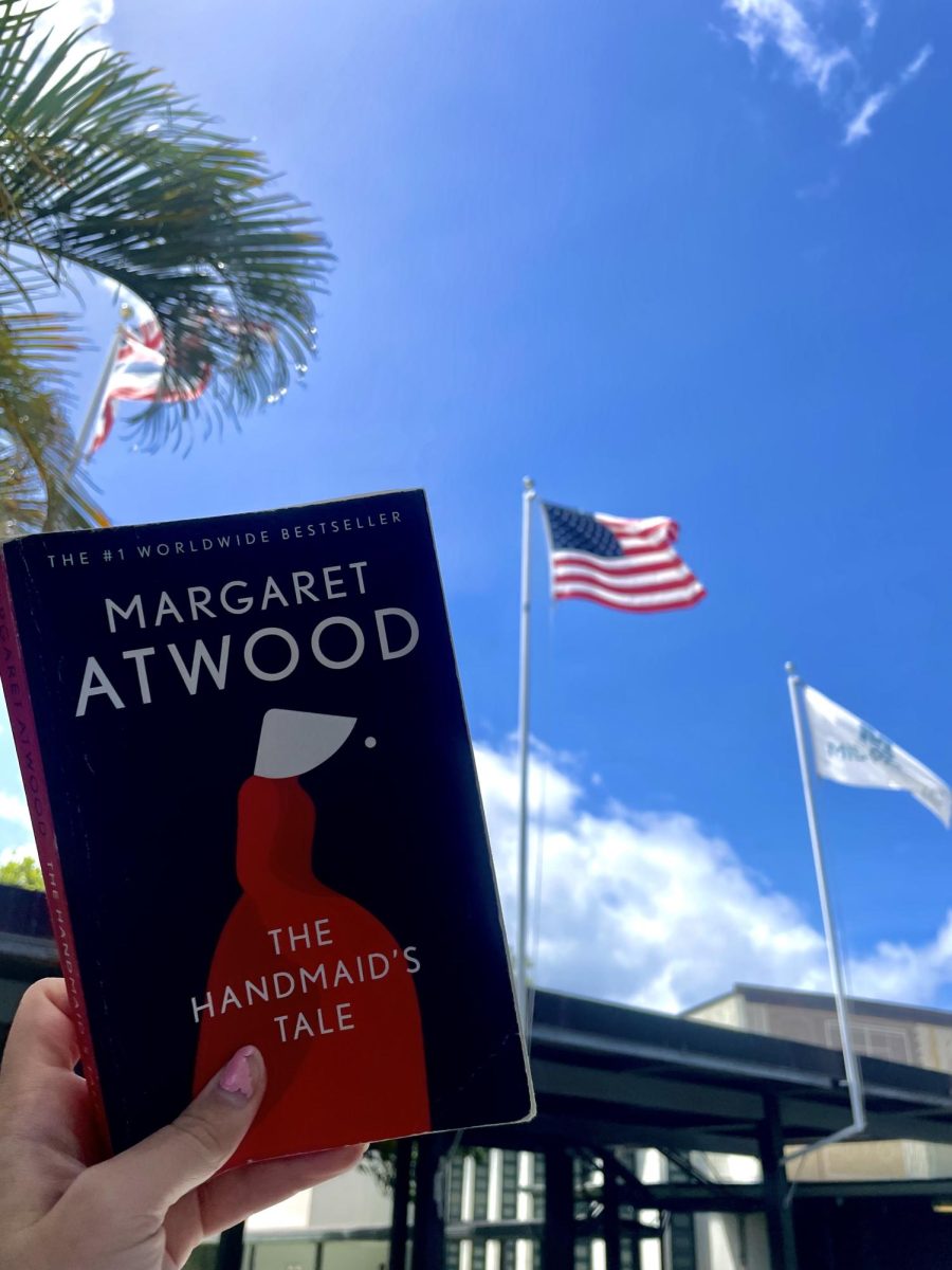 The Handmaid’s Tale held against the American flag.