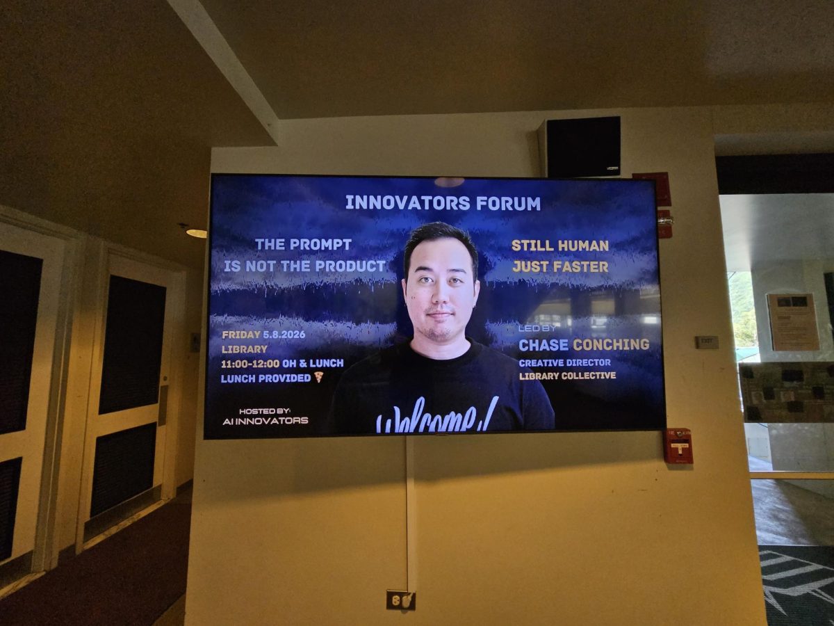 A poster displayed on a TV promoting the AI innovators club